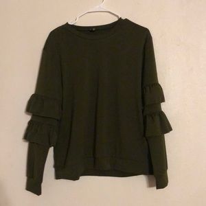 A two piece green ruffled outfit.